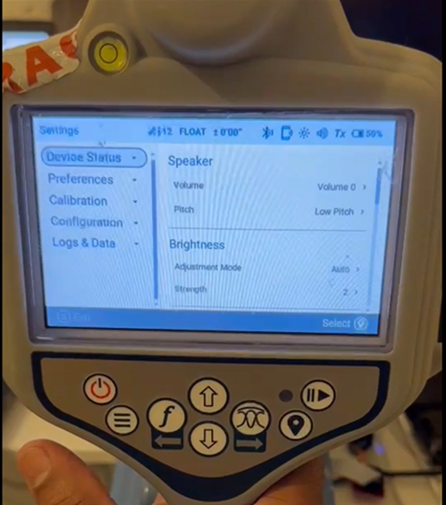 Handheld industrial field instrument running a Qt settings interface
